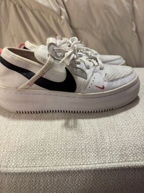 Nike Women’s White Sneakers with Black Swoosh and Pink Accent